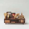 Wooden shelf with decorative items on a white background